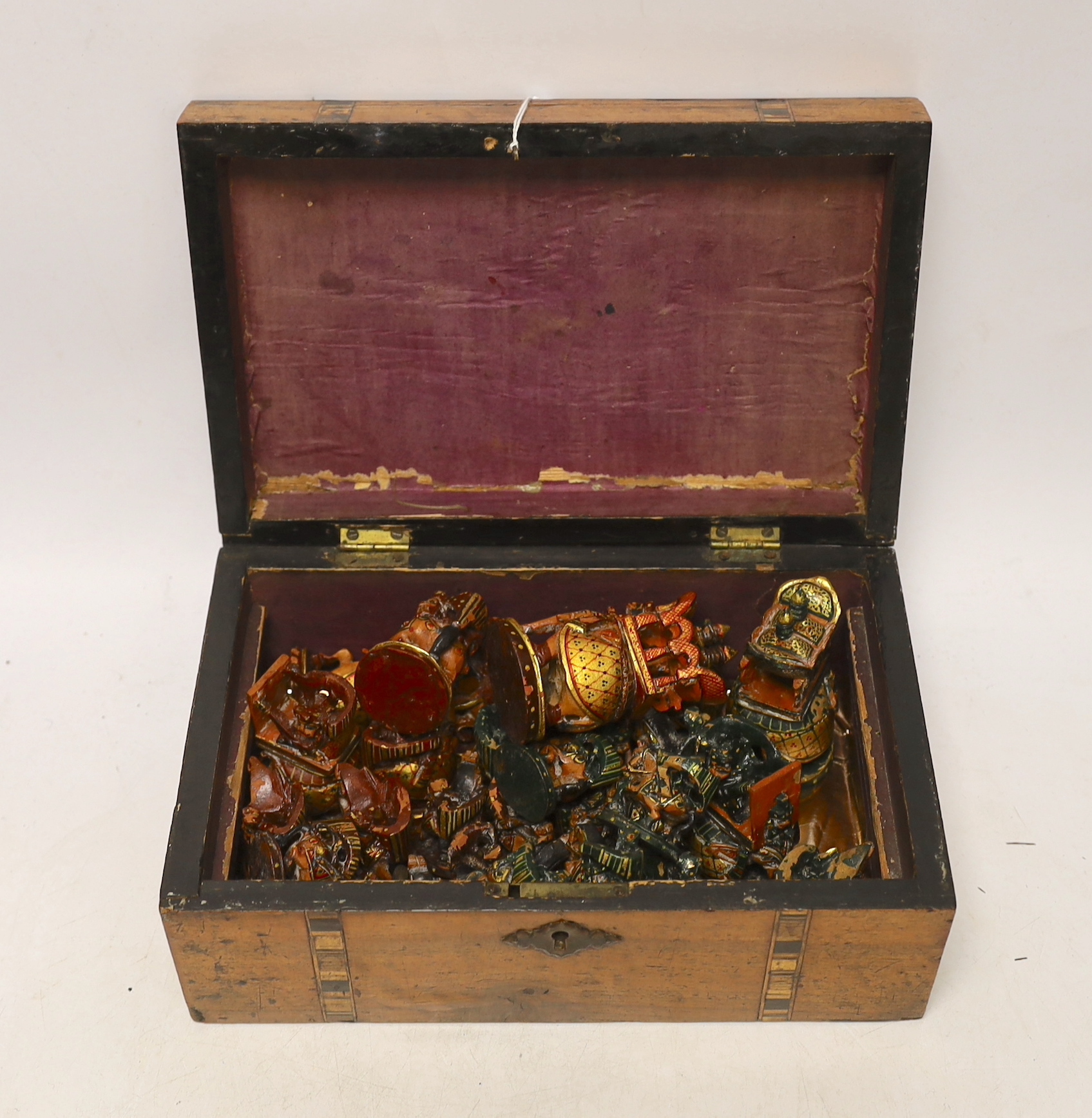 A North Indian carved and painted wood chess set, in an inlaid walnut box